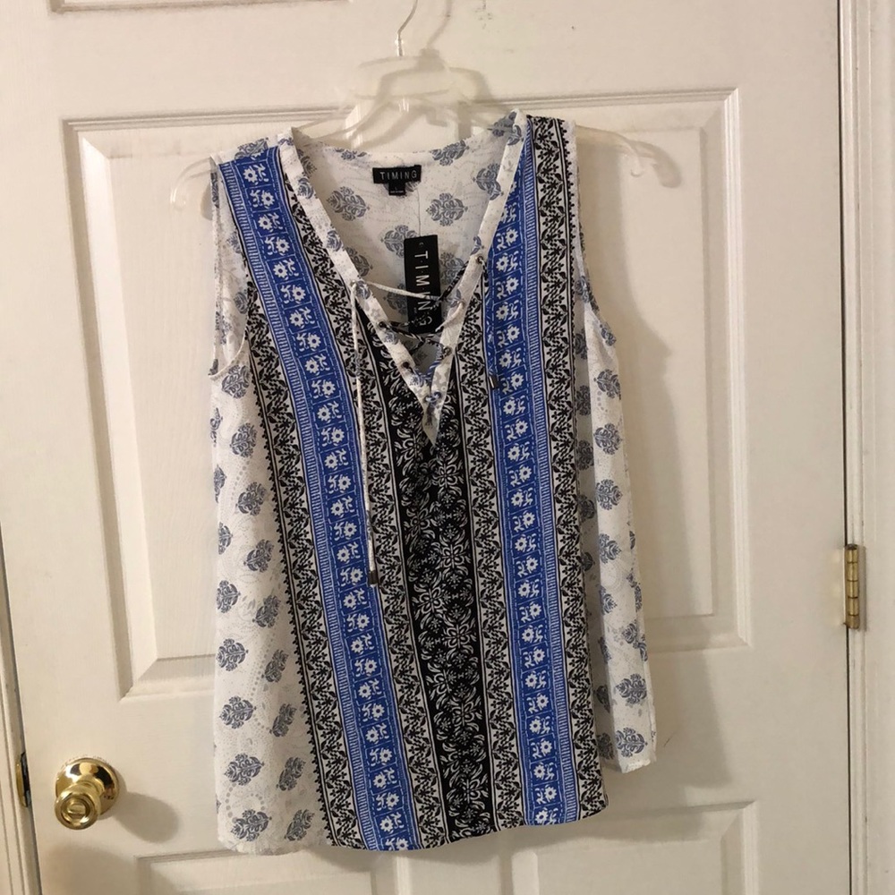 Timing sleeveless print top. Size large. New with tags.